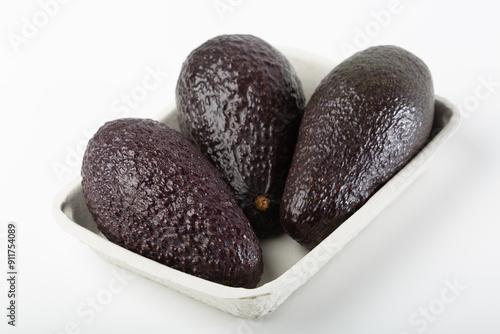 Fresh avocados on white background photo