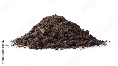 A pile of dirt sits on top of a white surface, great for use as an illustration or prop in various settings