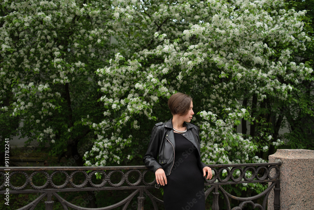 Woman standing in front of blooming tree Woman standing in front of blooming tree