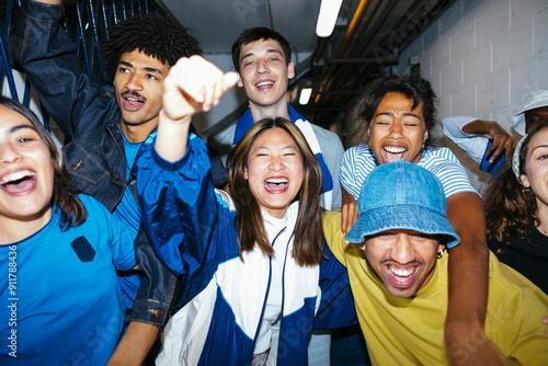 Group of friends screaming celebrating victory photo