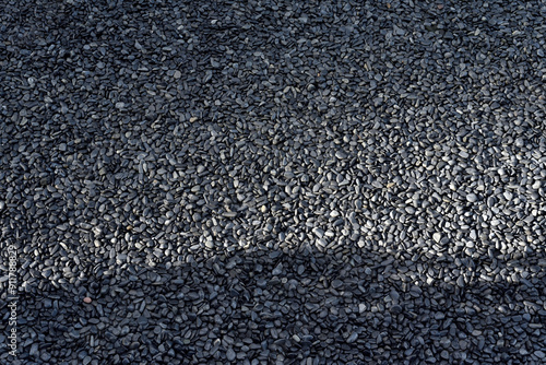 Texture of dark grey pebbles