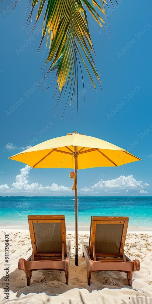 Two wooden beach chairs under bright yellow umbrella, palm tree in background, peaceful shore view, inviting relaxation, copy space. Two wooden beach chairs under bright yellow umbrella, palm tree in background, peaceful shore view, inviting relaxation, copy space.