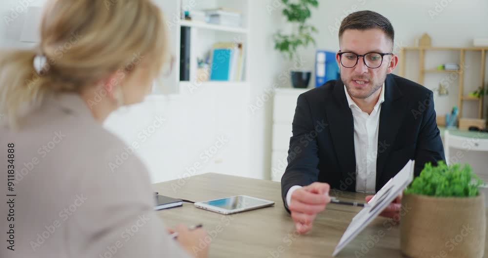 Real Estate Agent Presents Offer During Meeting Real Estate Agent Presents Offer During Meeting