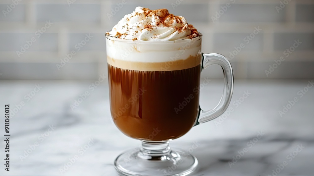 A creamy Irish coffee in a glass mug, topped with whipped cream and a sprinkle of cinnamon. A creamy Irish coffee in a glass mug, topped with whipped cream and a sprinkle of cinnamon.