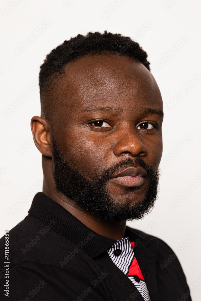 Portrait of a serious black man with a beard and short hair Portrait of a serious black man with a beard and short hair