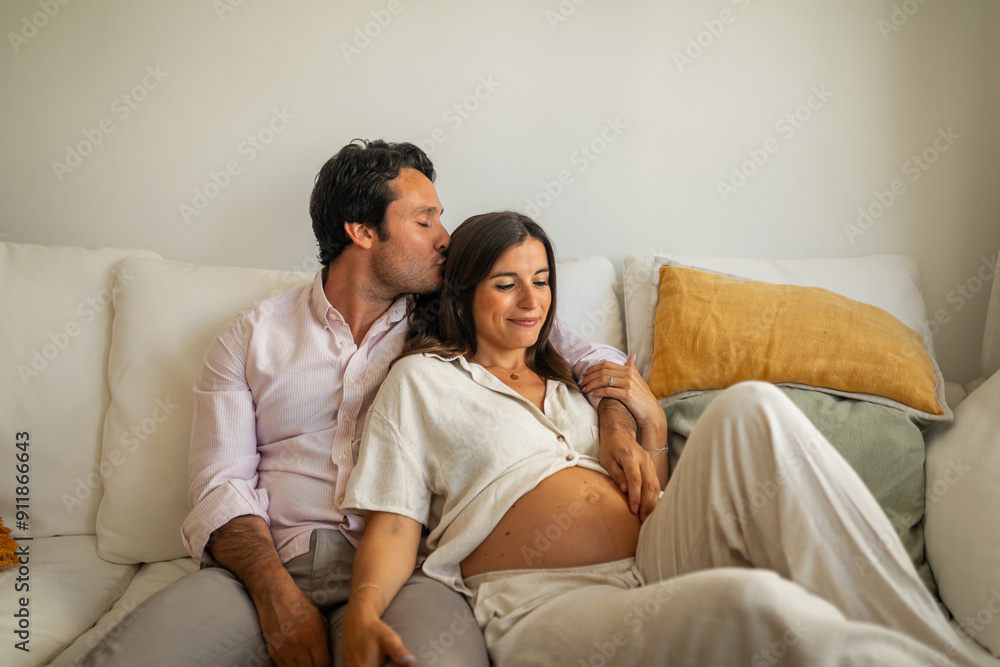 married couple with pregnant woman relaxing on the couch married couple with pregnant woman relaxing on the couch