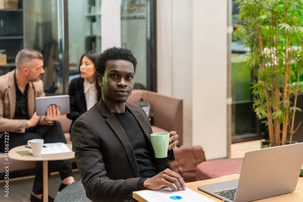 Man Holding Coffee Mug And Looking At Camera Man Holding Coffee Mug And Looking At Camera