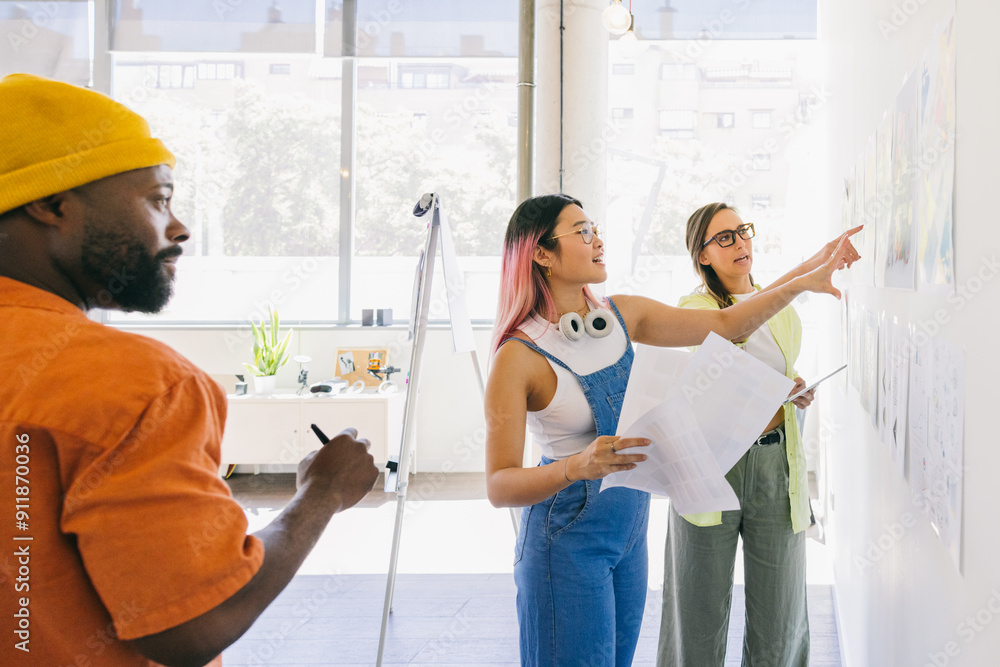 © VICTOR TORRES/Stocksy - Creative multi-ethnic team brainstorming ideas in modern office space. © VICTOR TORRES/Stocksy - Creative multi-ethnic team brainstorming ideas in modern office space.