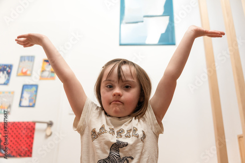 Girl With Down Syndrome Raising Arms

 photo