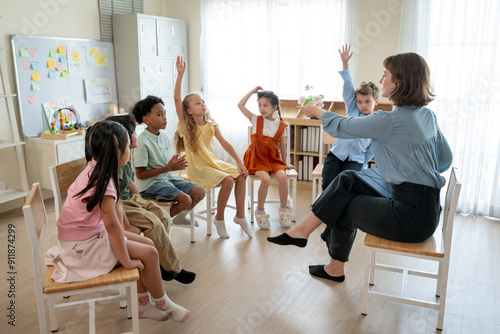 Caucasian young woman teacher teaching student in classroom at school photo