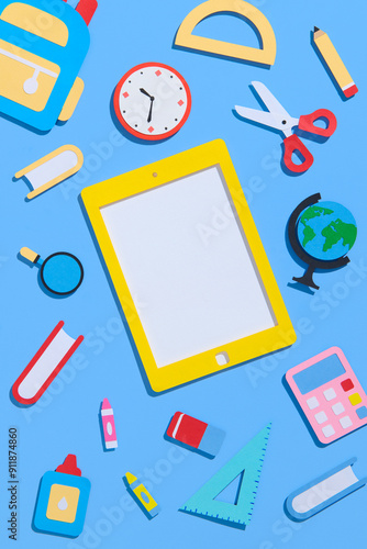School notebook and various stationery on light blue background.