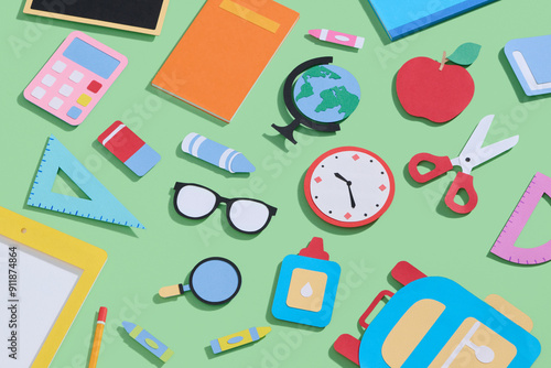Paper cut school supplies set in polygonal trendy craft style.