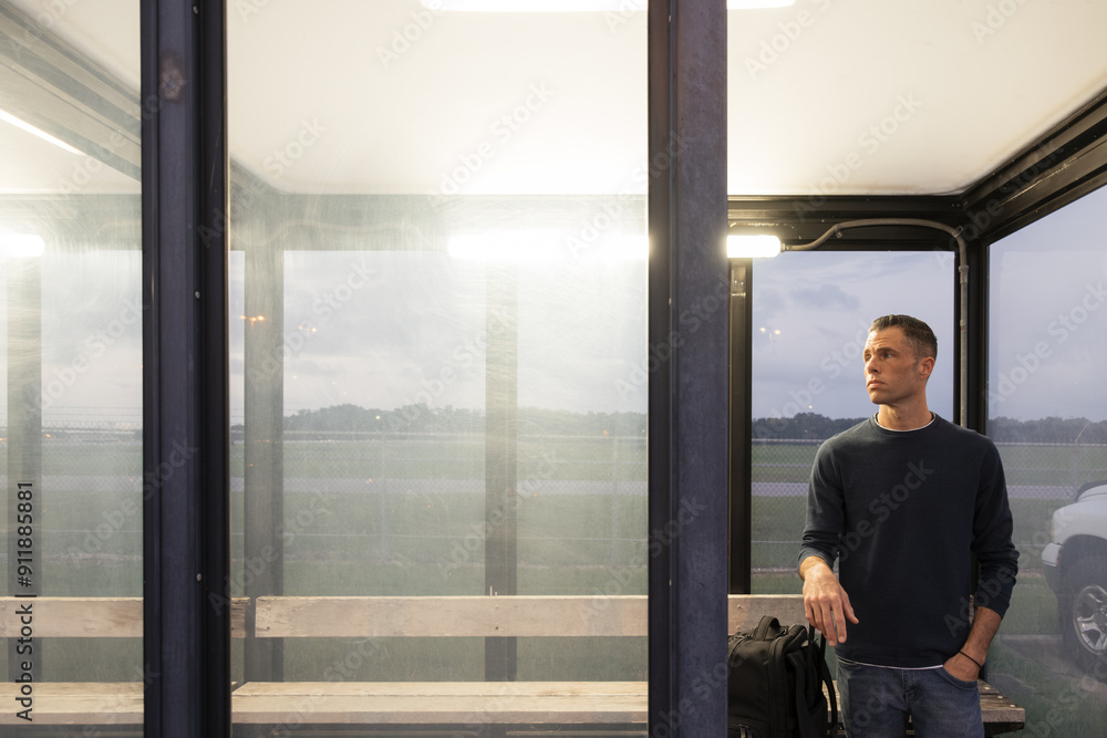 Man in Airport Shuttle Bus Stop Man in Airport Shuttle Bus Stop