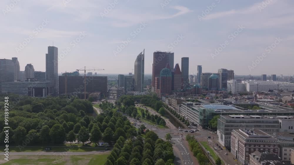 Aerial view of The Hague's skyline featuring modern skyscrapers and green landscapes. Urban and architectural themes Aerial view of The Hague's skyline featuring modern skyscrapers and green landscapes. Urban and architectural themes