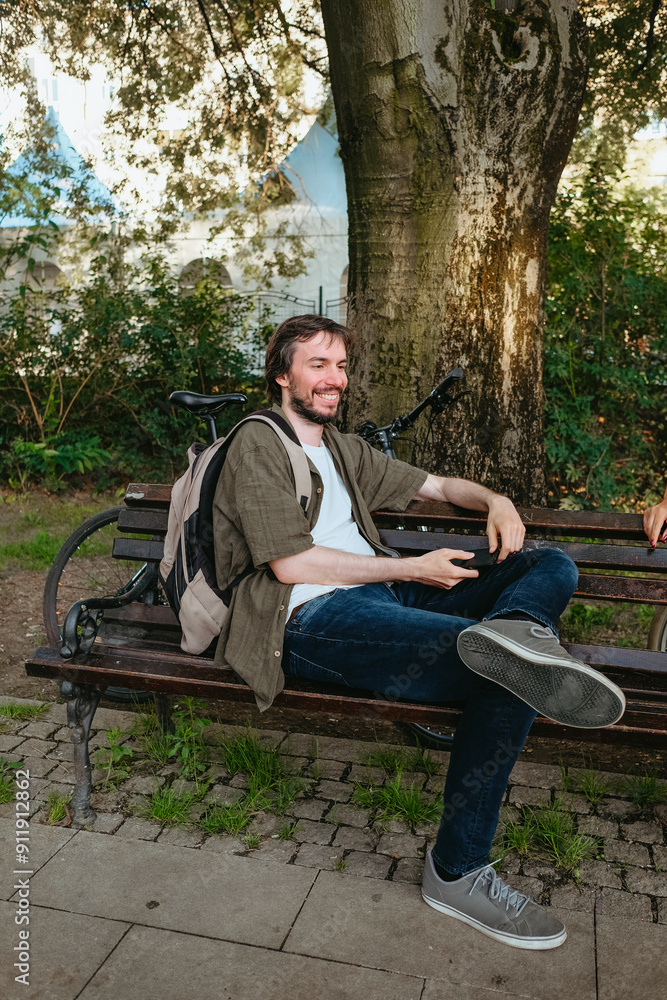 Man sitting on a bench in the park Man sitting on a bench in the park