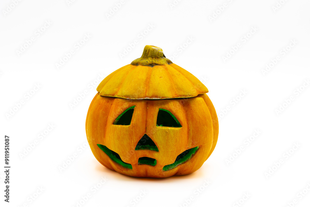 Jack O Lantern isolated on white background. Ceramic candle holder in the shape of a halloween pumpkin. Jack O Lantern isolated on white background. Ceramic candle holder in the shape of a halloween pumpkin.