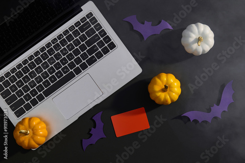 Halloween Shopping With Laptop, Pumpkins, Bats and Credit Card photo