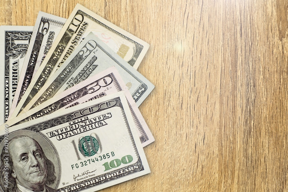 $100 dollar bills. American money on the desk $100 dollar bills. American money on the desk