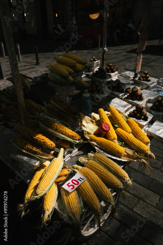 Street Vendor Selling Corn and Chestnuts photo