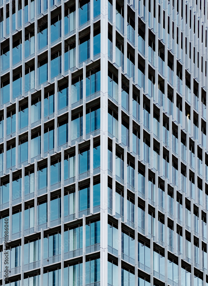 Close-up of modern glass building facade with geometric pattern Close-up of modern glass building facade with geometric pattern