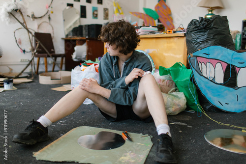 a young woman makes decorations in the workshop photo