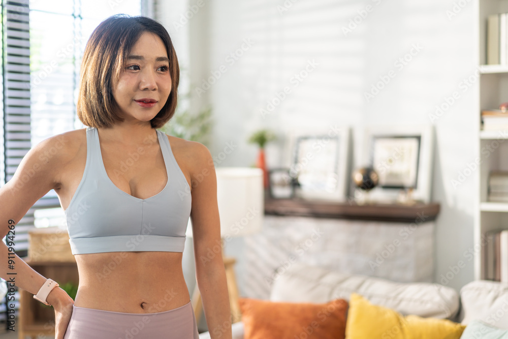 Portrait of sport slim fit strength asian woman training in sportswear relax and practicing yoga, fitness, exercise, wellness, workout, sport at home.Diet concept.Fitness and healthy lifestyle Portrait of sport slim fit strength asian woman training in sportswear relax and practicing yoga, fitness, exercise, wellness, workout, sport at home.Diet concept.Fitness and healthy lifestyle