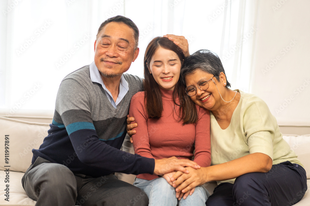 Portrait enjoy happy smiling love asian family.Senior mature father hug with elderly mother and young adult woman play laughing and having fun together at home.insurance concept Portrait enjoy happy smiling love asian family.Senior mature father hug with elderly mother and young adult woman play laughing and having fun together at home.insurance concept