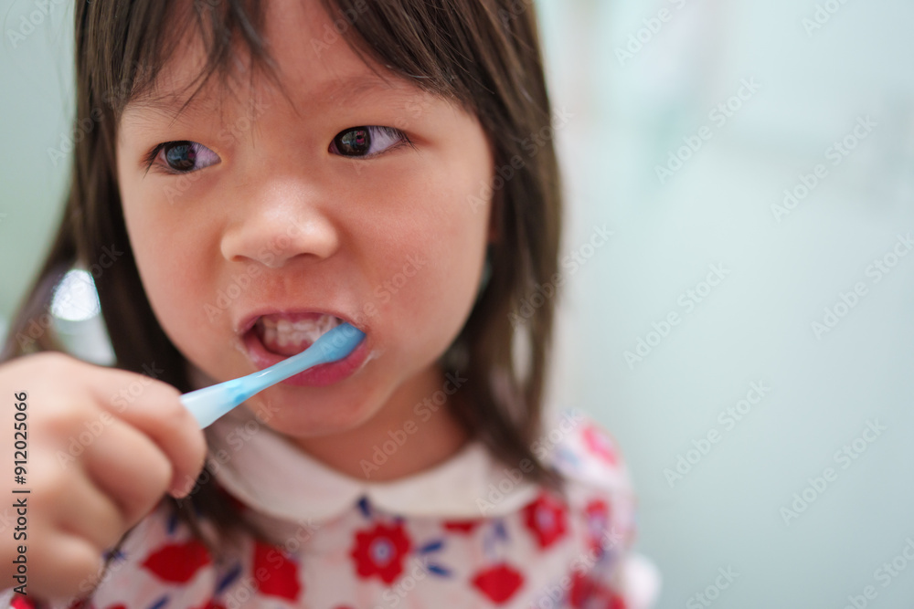 Asian little kid brushing teeth Asian little kid brushing teeth