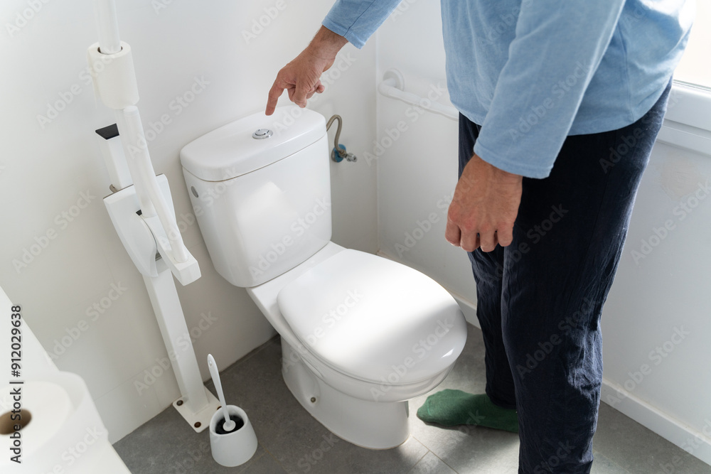 Man flushing toilet Man flushing toilet