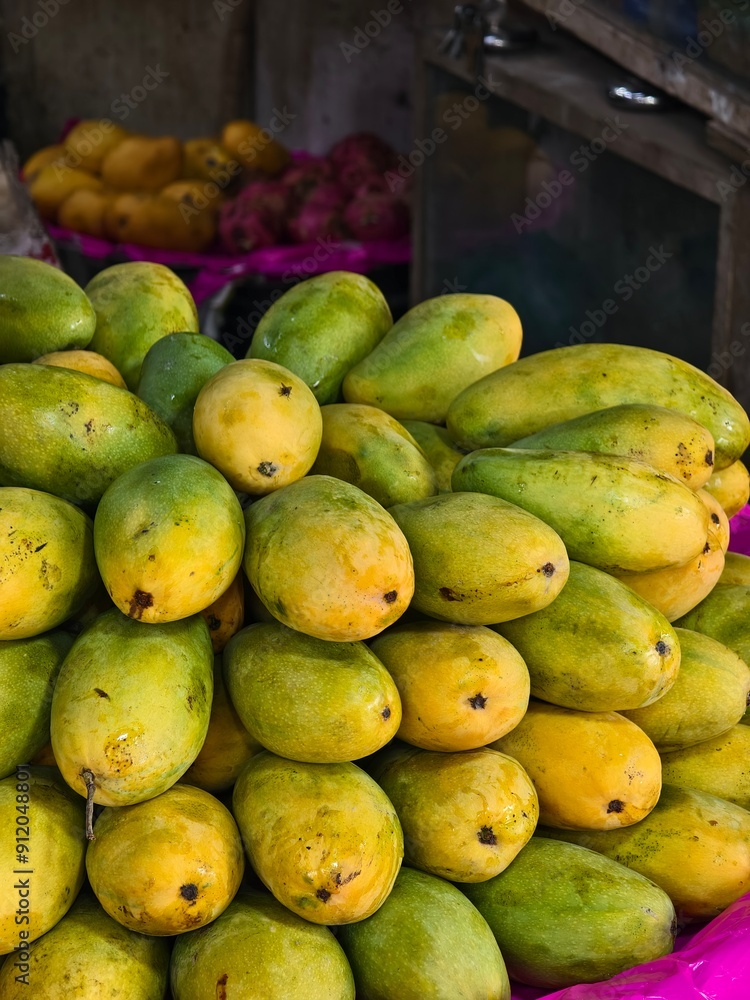 Fresh organic tropical mango fruits selling in a retail shop Fresh organic tropical mango fruits selling in a retail shop