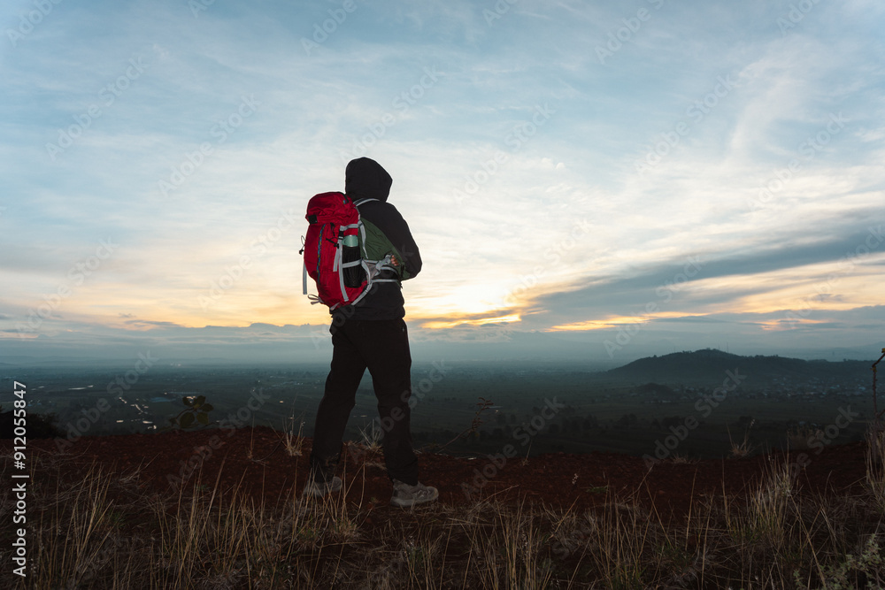 Hiker at the Summit at Sunrise Hiker at the Summit at Sunrise