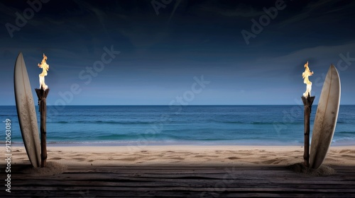 A beach stage setup with tiki torches and surfboards photo