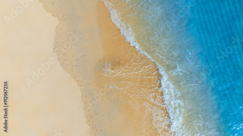 Top view beach sand background for summer vacation concept. Beach nature and summer seawater with sunlight light sandy beach Sparkling sea water	 photo