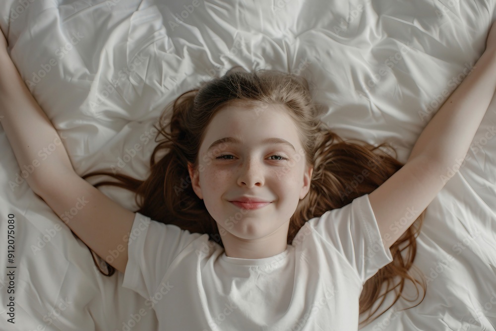 A little girl is sleeping, in a comfortable room, looking up, and spreading her arms, indicating comfort and calm of circulation or nerve compression. A little girl is sleeping, in a comfortable room, looking up, and spreading her arms, indicating comfort and calm of circulation or nerve compression.