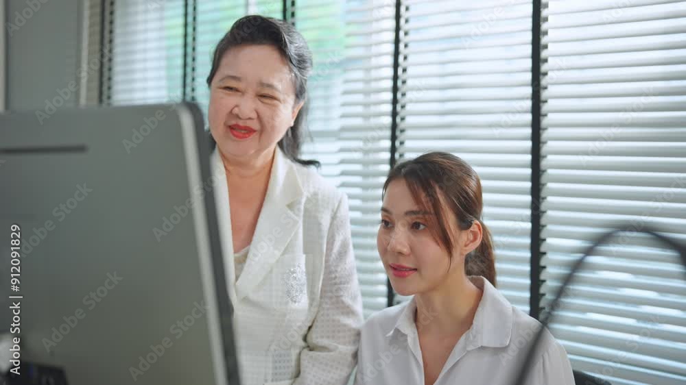Asian senior executive and businesswoman worker working in the office. Asian senior executive and businesswoman worker working in the office.