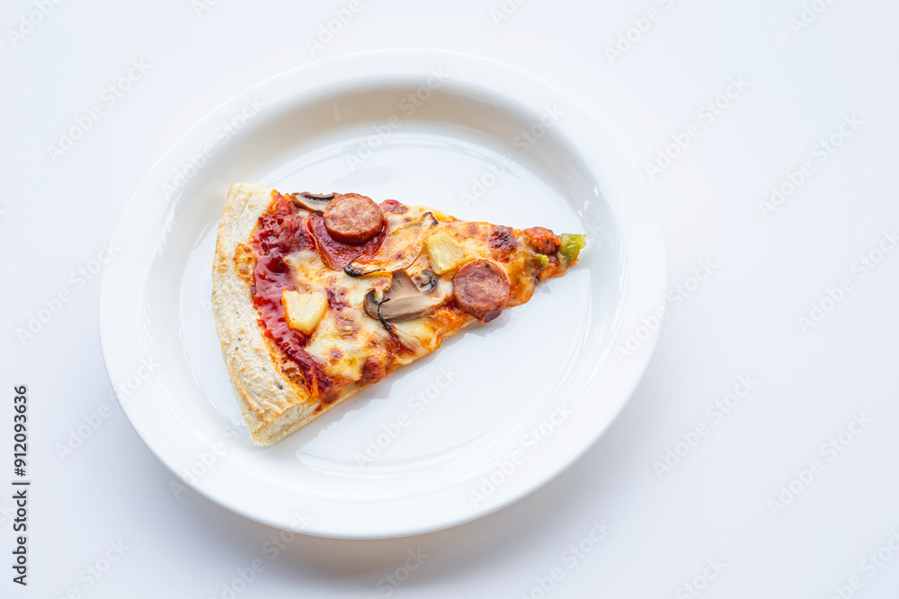 Top view a piece of pizza on white dish.Simple food and eating Top view a piece of pizza on white dish.Simple food and eating
