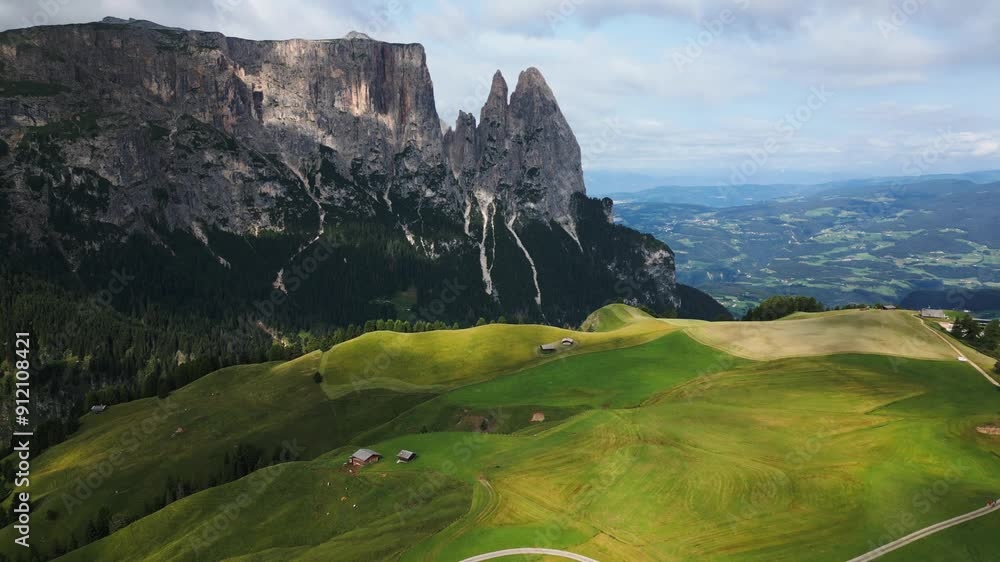 beautiful green alp in the mountains with a blue sky, green trees and a big mountain in the background, dolomites, italy, europe, drone beautiful green alp in the mountains with a blue sky, green trees and a big mountain in the background, dolomites, italy, europe, drone