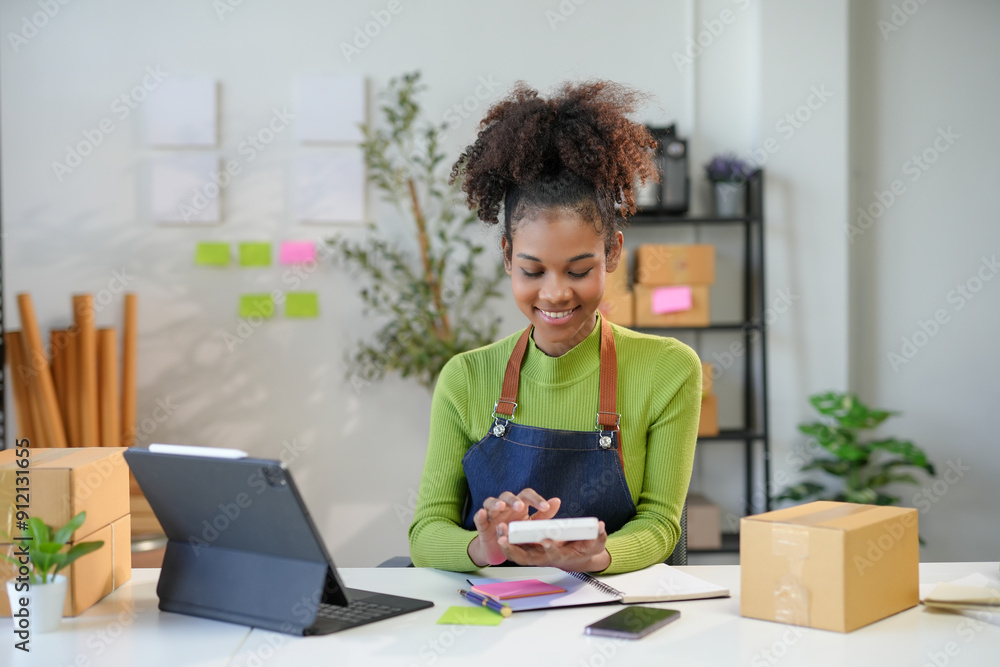 Young entrepreneur smiling and calculating finance of her business at home office Young entrepreneur smiling and calculating finance of her business at home office
