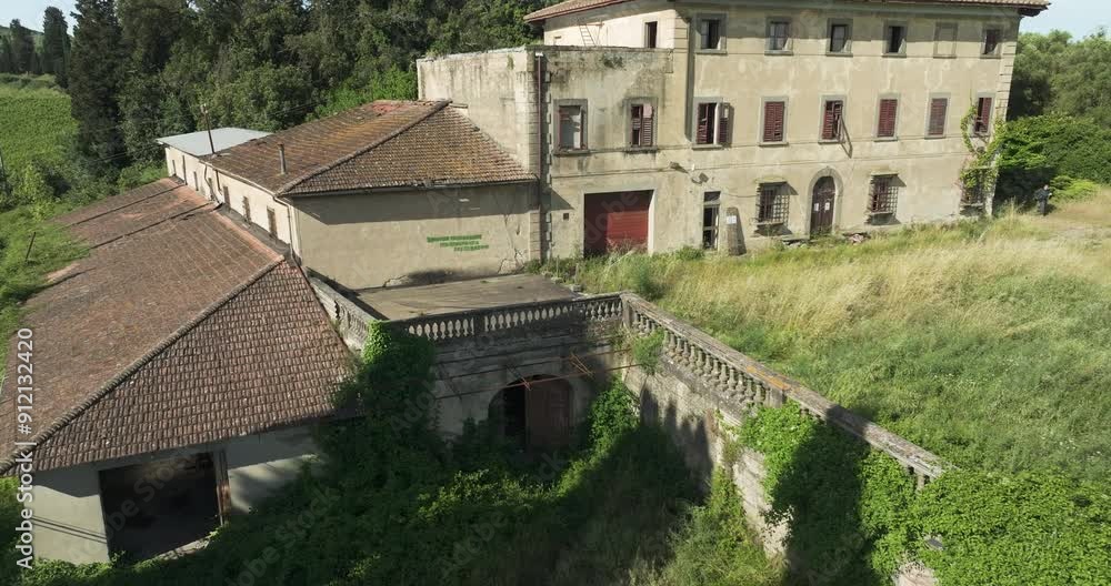 An abandoned villa in Italy, surrounded by overgrown greenery, seen from above An abandoned villa in Italy, surrounded by overgrown greenery, seen from above