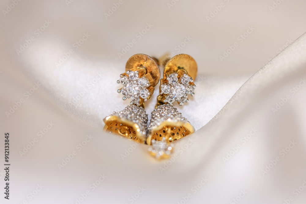 Two elegant Indian style diamond and 24 carrot gold earrings. Two elegant Indian style diamond and 24 carrot gold earrings.