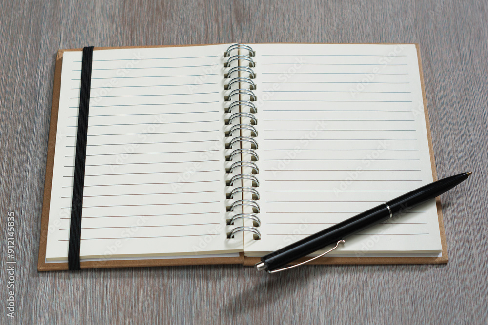 Spiral notebook and pen Spiral notebook and pen