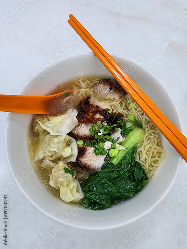 Popular breakfast meal. Wanton Noodle Soup with Char Siu, Wanton Dumplings and Choy Sum Vegetables. Great for breakfast, lunch or dinner photo