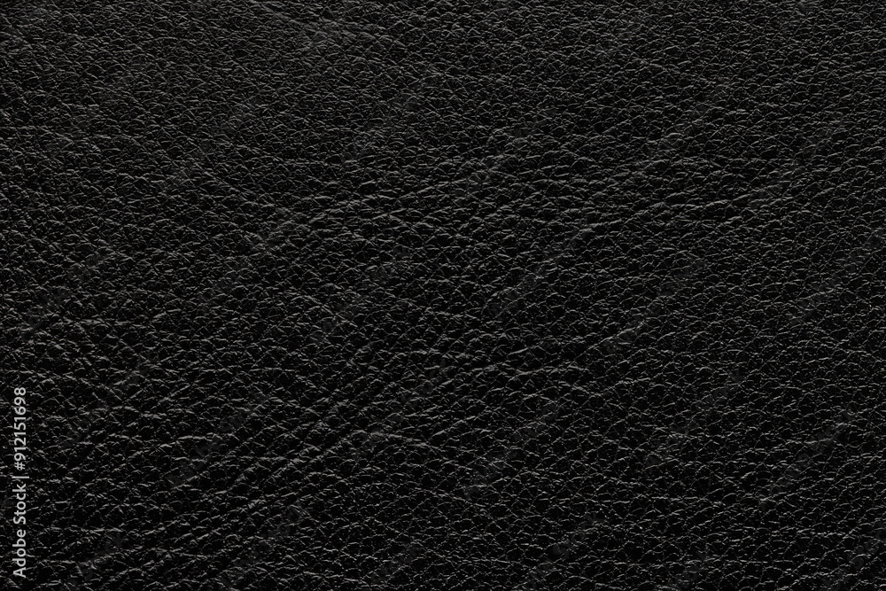 Genuine black leather. Background or texture sample. Studio shot. Genuine black leather. Background or texture sample. Studio shot.