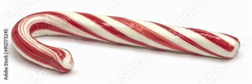 Red and White Candy Cane Isolated on White Background - A single red and white candy cane isolated on a white background. The candy cane is a classic Christmas treat, symbolizing holiday cheer, sweetn photo