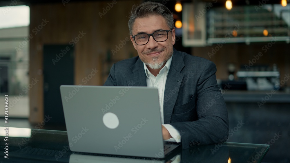 Business portrait - businessman with laptop at cafe Business portrait - businessman with laptop at cafe