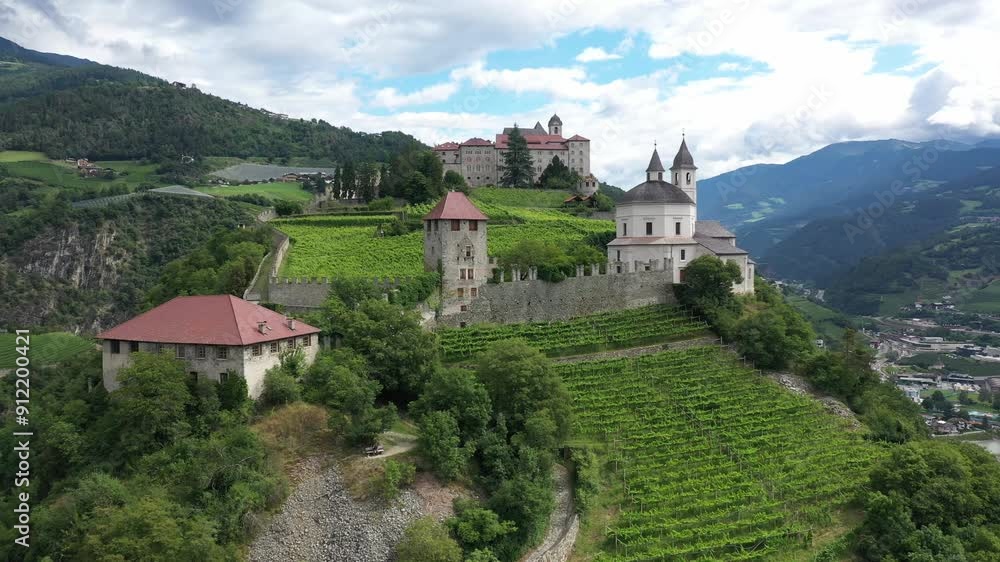Aerial view of Castle on the rock, vineyards and winery on a sunny summer day Bolzano Italy Aerial view of Castle on the rock, vineyards and winery on a sunny summer day Bolzano Italy