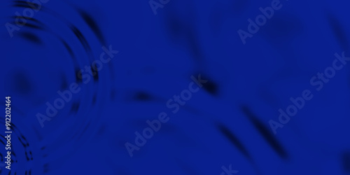 The transparent blue water surface is slightly shaded with unclear details. Blue water with ripples on the surface. Defocus blurred transparent gold colored clear calm water.