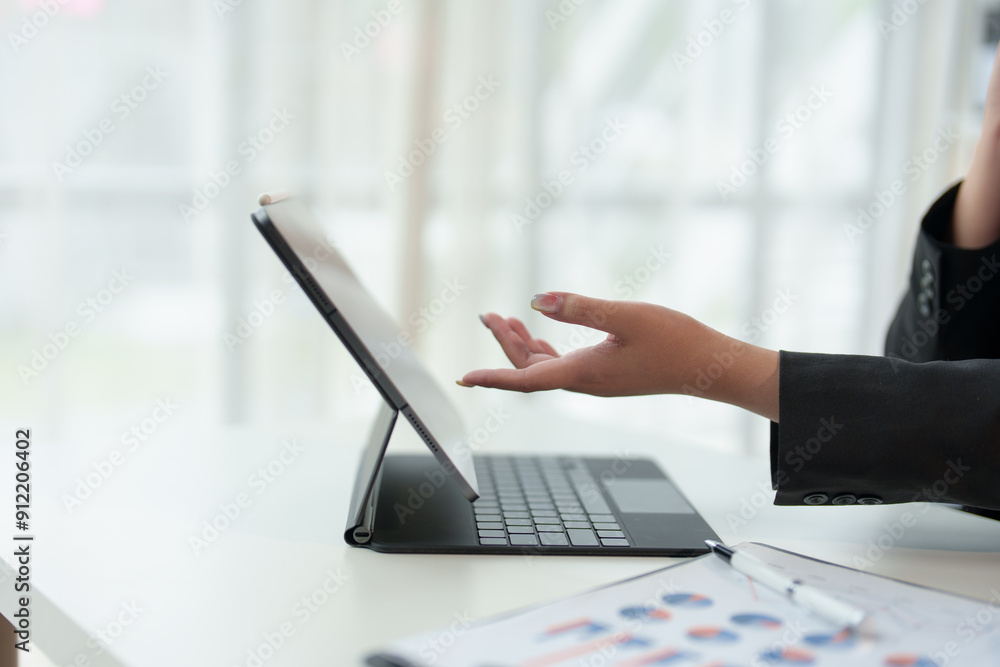 Cropped view of woman's hands typing on laptop computer keyboard and surfing internet on desk, online, work, business and technology, internet network communication concept in office. Cropped view of woman's hands typing on laptop computer keyboard and surfing internet on desk, online, work, business and technology, internet network communication concept in office.