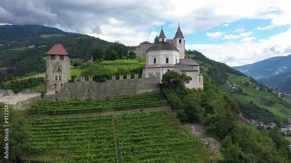 Aerial view of Castle on the rock, vineyards and winery on a sunny summer day Bolzano Italy Aerial view of Castle on the rock, vineyards and winery on a sunny summer day Bolzano Italy