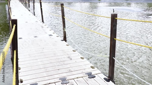 bridge over lake with moving water